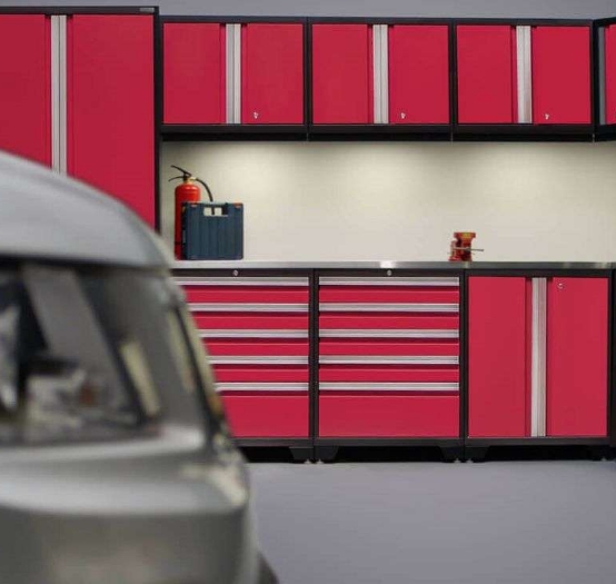 a wall of red steel cabinets provides bright contrast in this garage renovation