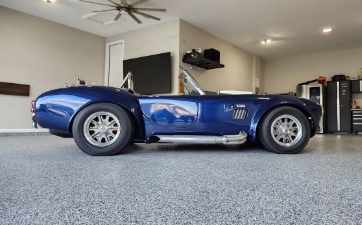 sports car parked on a coated garage floor